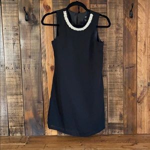 Black dress with pearl neckline